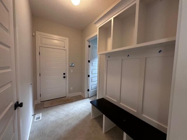 mudroom featuring light tile patterned floors