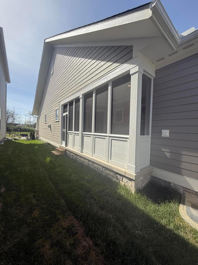 5599 Piatt Rd, Lewis Center, OH 43035 - view of side of property with a yard, entry steps, and a sunroom
