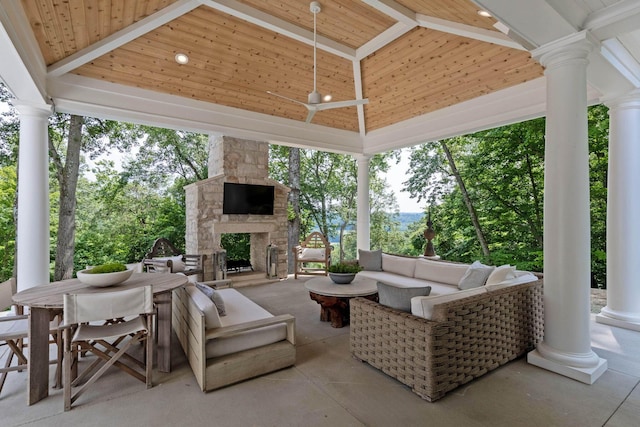 view of patio featuring an outdoor living space with a fireplace, a gazebo, and ceiling fan