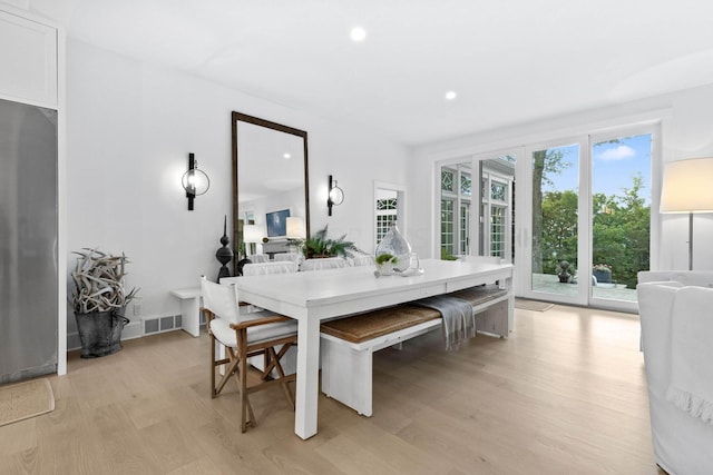 dining room with light hardwood / wood-style flooring