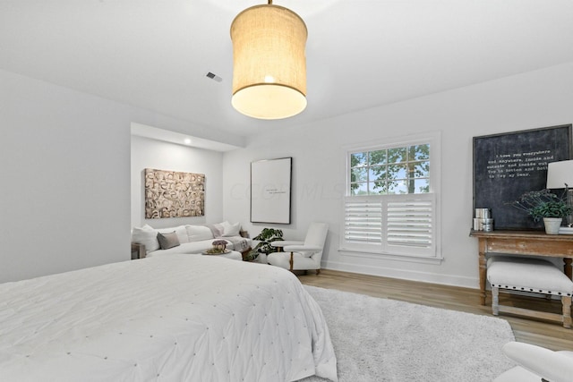 bedroom with wood-type flooring