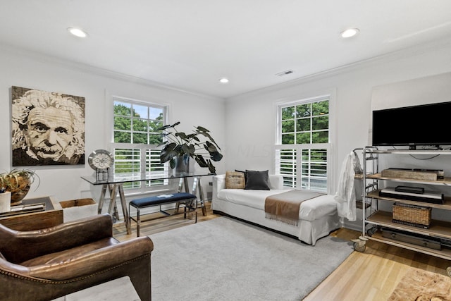 living room with crown molding and wood-type flooring