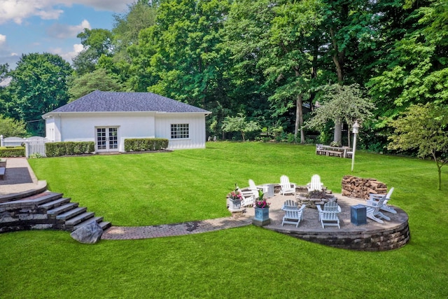 view of yard with a fire pit