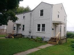 rear view of house with a yard