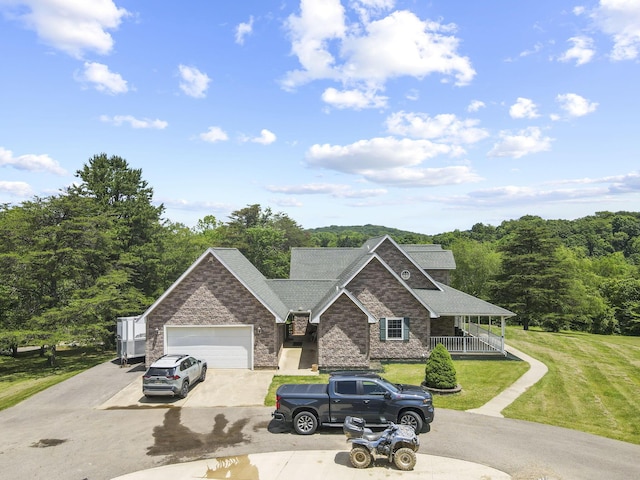 view of front of house featuring a garage and a front yard