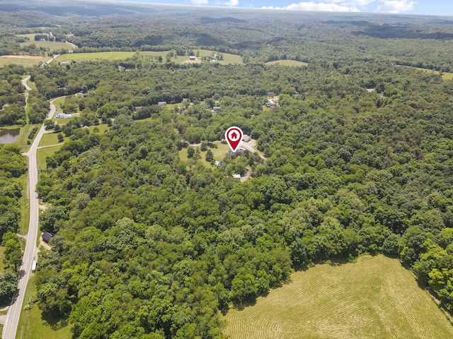 birds eye view of property featuring a rural view