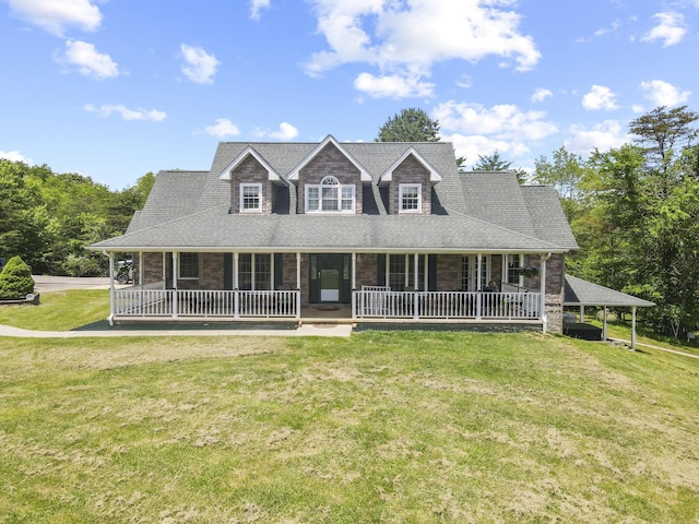 view of front of home with a front lawn, covered porch, and a carport