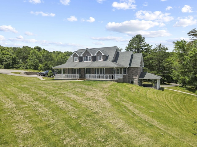 view of front of property featuring covered porch and a front yard