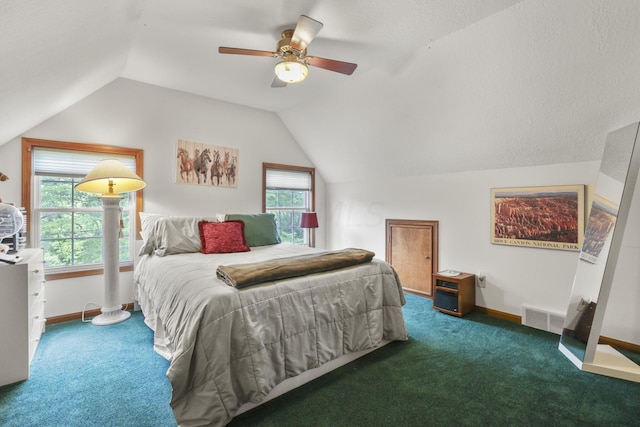 carpeted bedroom with vaulted ceiling and ceiling fan