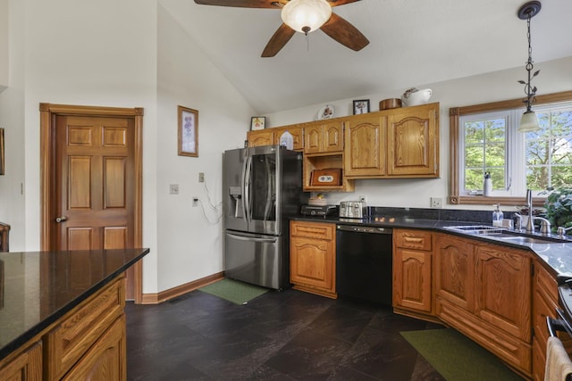 kitchen with high vaulted ceiling, sink, ceiling fan, appliances with stainless steel finishes, and decorative light fixtures