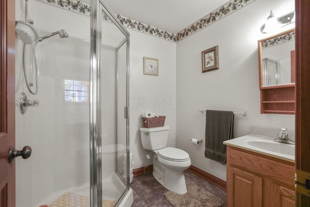 bathroom with vanity, toilet, and a shower with door