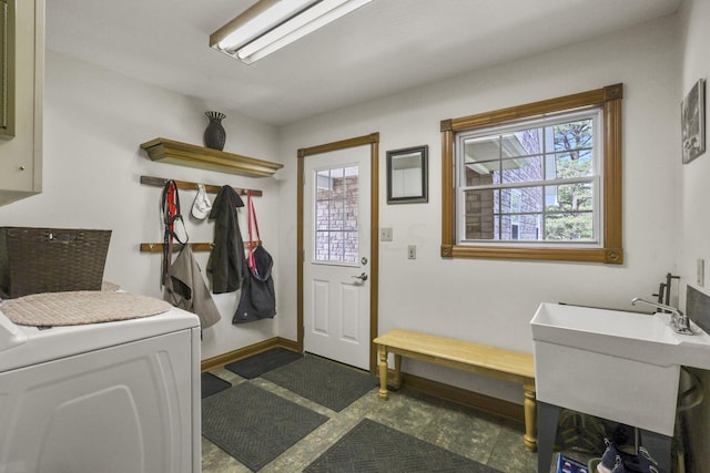 laundry area with plenty of natural light, washer / dryer, and sink