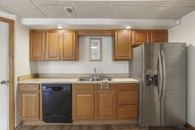 kitchen featuring dishwasher, stainless steel fridge with ice dispenser, dark hardwood / wood-style flooring, and sink