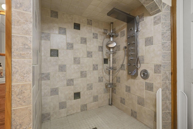 bathroom with tiled shower