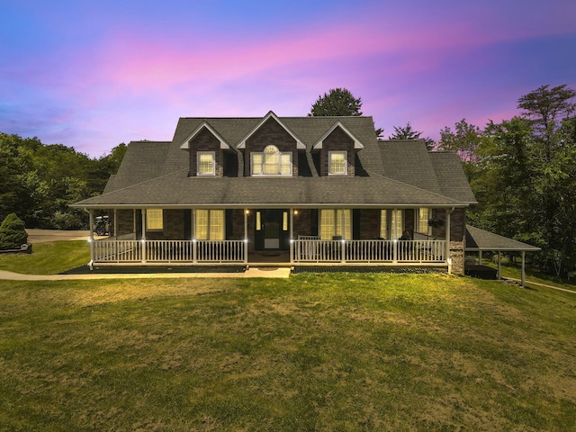 view of front of house with a carport and a lawn