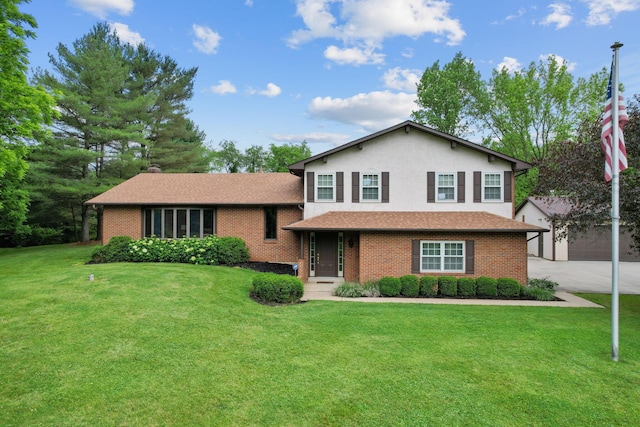 split level home featuring a garage and a front lawn