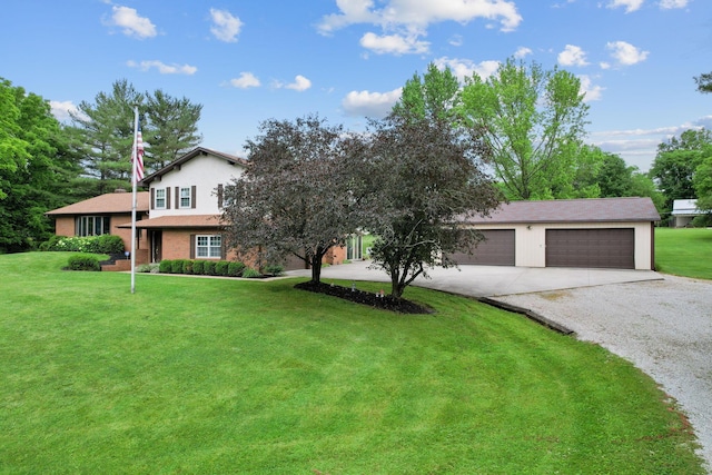 view of front of property featuring a front yard and a garage