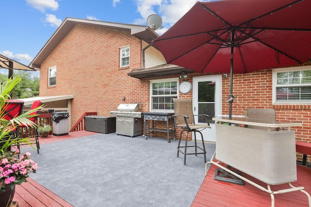 wooden deck featuring area for grilling