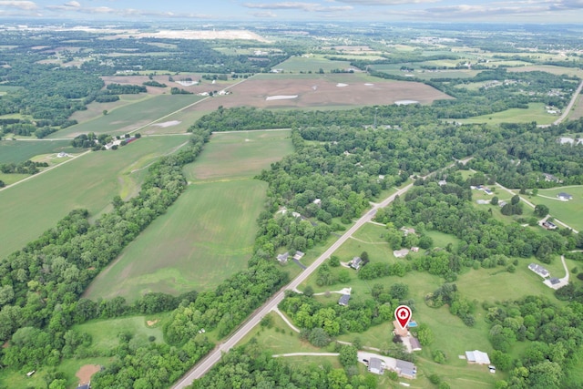 birds eye view of property featuring a rural view