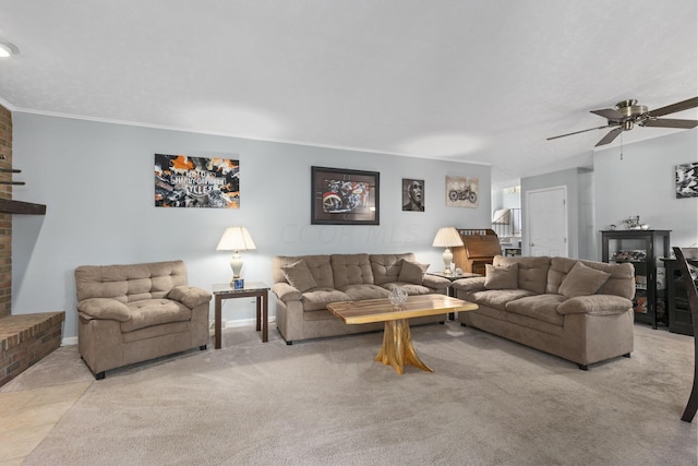 living room featuring ceiling fan, light colored carpet, and ornamental molding