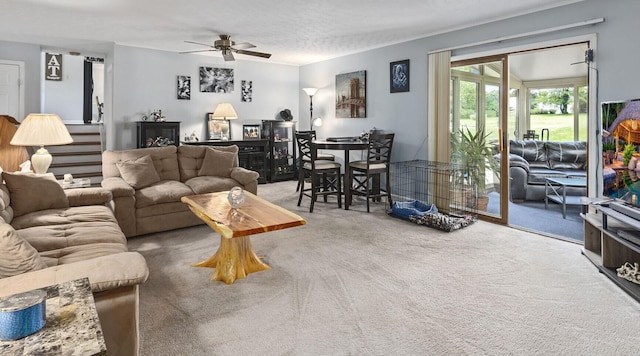 living room with carpet flooring and ceiling fan