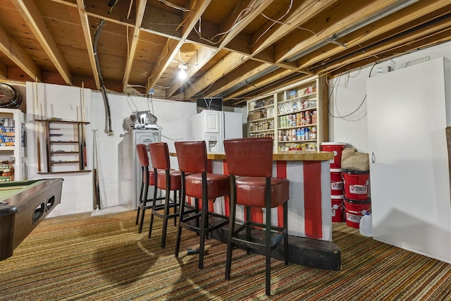 bar featuring white refrigerator with ice dispenser and pool table