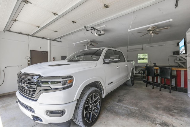 garage with separate washer and dryer and a garage door opener