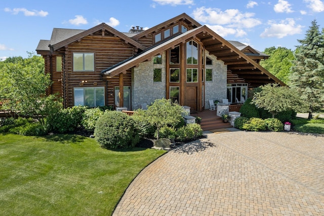 cabin featuring a front lawn