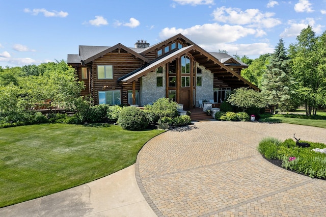 cabin with a front lawn