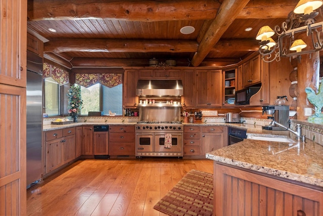 kitchen with high end appliances, sink, light hardwood / wood-style flooring, light stone countertops, and beamed ceiling