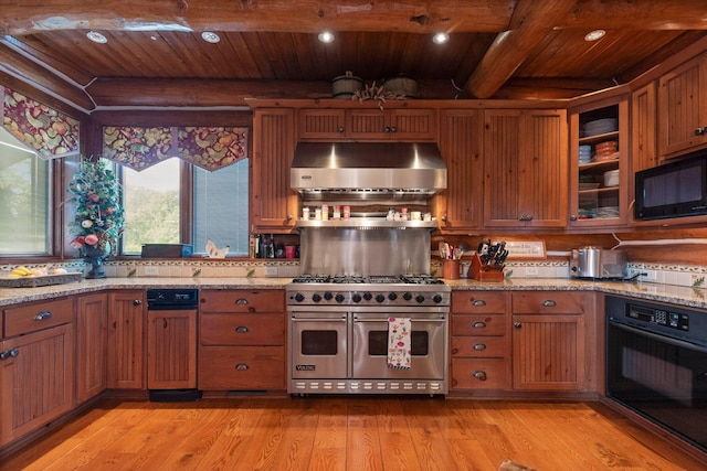 kitchen featuring wooden ceiling, light stone counters, light hardwood / wood-style flooring, beamed ceiling, and black appliances