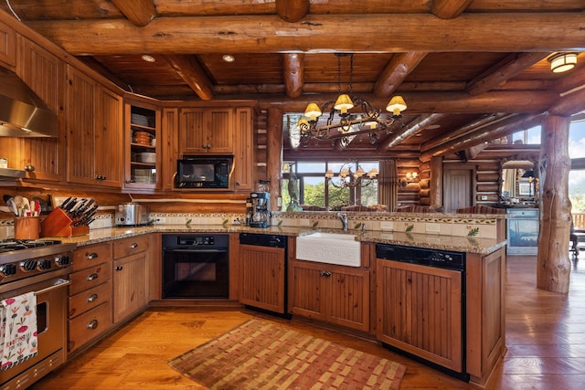 kitchen with light wood-type flooring, wood ceiling, a notable chandelier, and black appliances