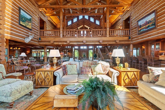 living room with beam ceiling, rustic walls, high vaulted ceiling, and wood ceiling