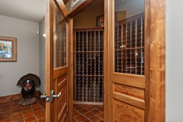 wine area with dark tile patterned flooring