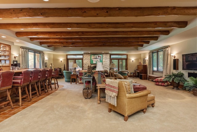 living room with beam ceiling and carpet floors