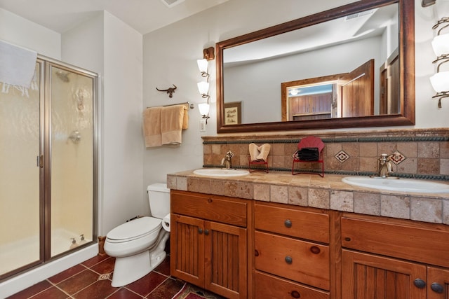 bathroom featuring tile patterned flooring, decorative backsplash, an enclosed shower, and vanity