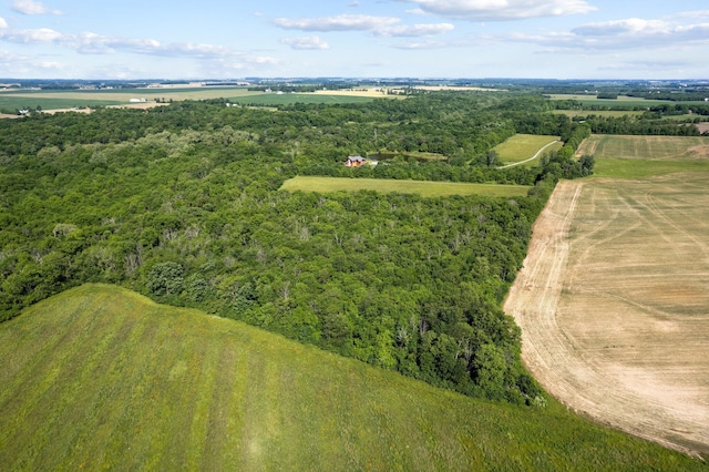 birds eye view of property with a rural view