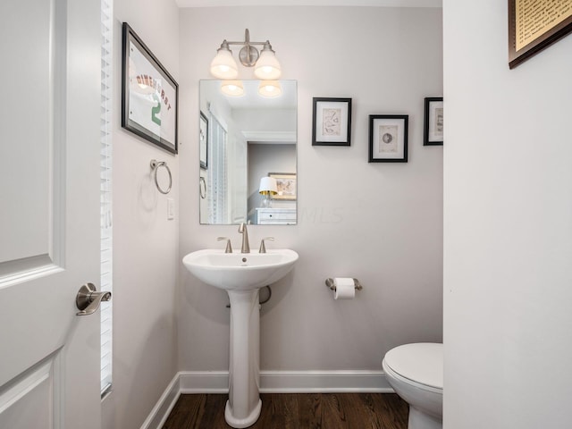 bathroom featuring toilet and hardwood / wood-style flooring