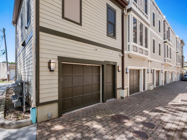 view of side of property featuring a garage