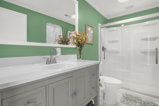 bathroom featuring vanity, toilet, and an enclosed shower