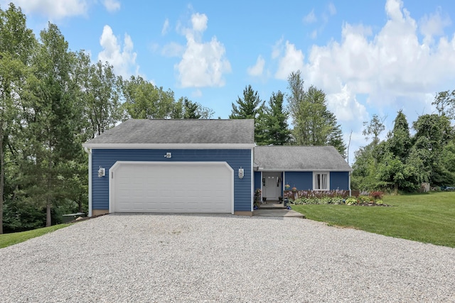 view of front of home featuring a garage and a front yard