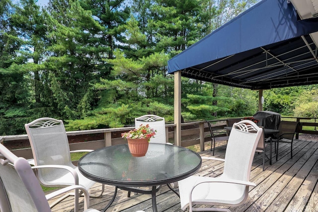 wooden deck with grilling area