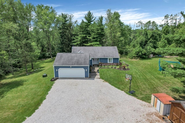 view of front of house with a front lawn and a garage