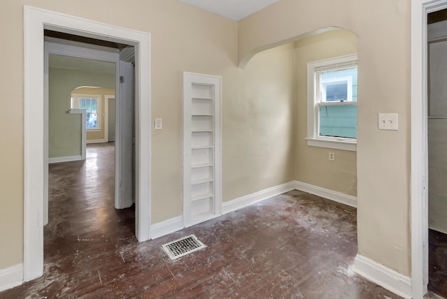 hallway with dark hardwood / wood-style floors