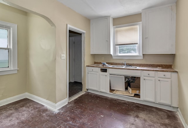 kitchen with white cabinetry and sink