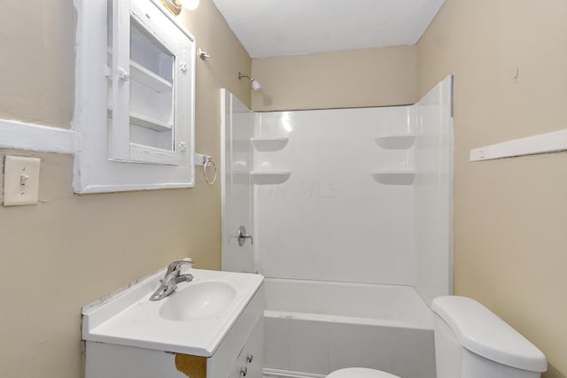 full bathroom with vanity, toilet, and washtub / shower combination