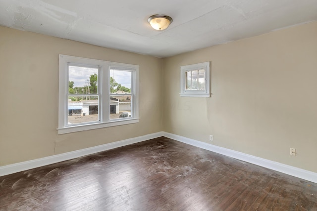 empty room featuring dark wood-type flooring