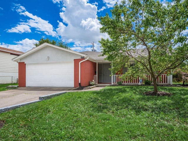 ranch-style house featuring a front yard and a garage