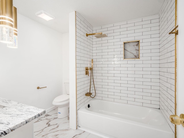 full bathroom featuring toilet, vanity, and tiled shower / bath combo