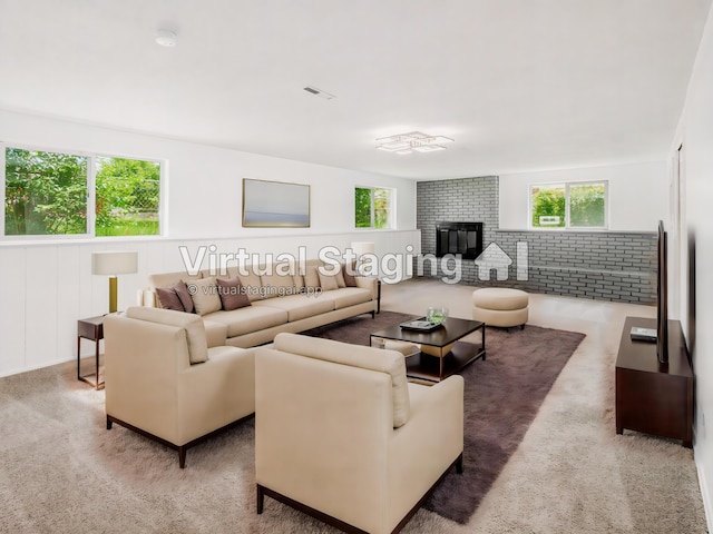 carpeted living room featuring a healthy amount of sunlight